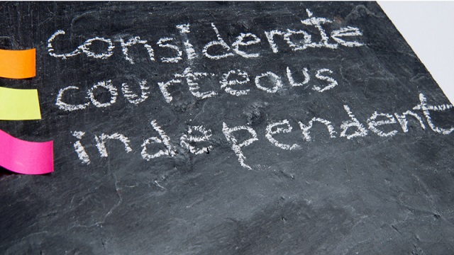 Chalkboard with 3 stickies and words: considerate, courteous, independent
